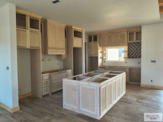 9728 Heights S Unit 9, Harlingen, TX 78552 - kitchen with a kitchen island and wood finished floors