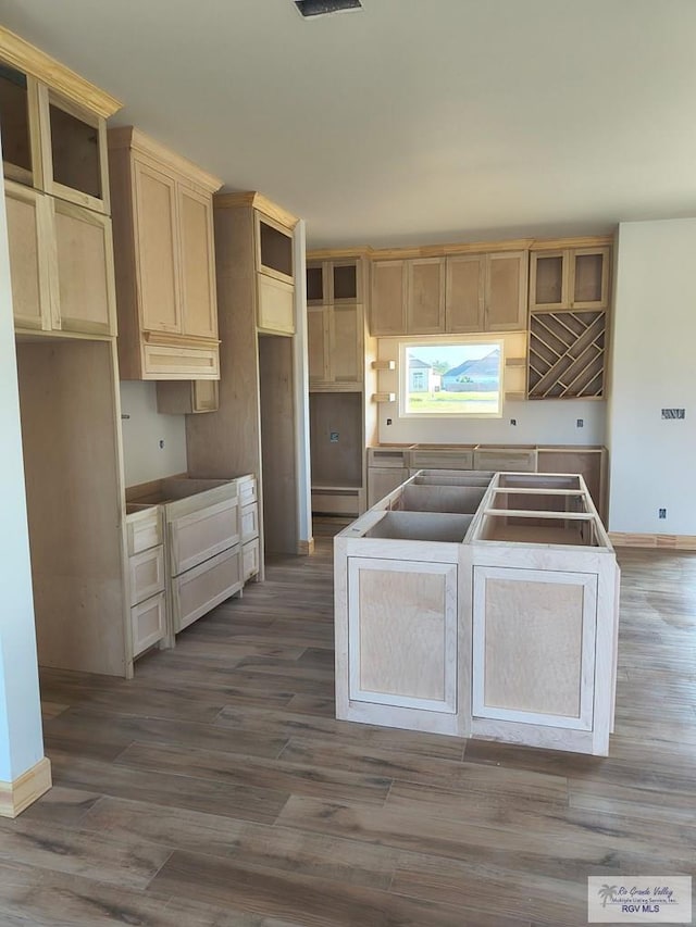 9728 Heights S Unit 9, Harlingen, TX 78552 - kitchen with dark wood-style floors, a kitchen island, a baseboard heating unit, and open shelves