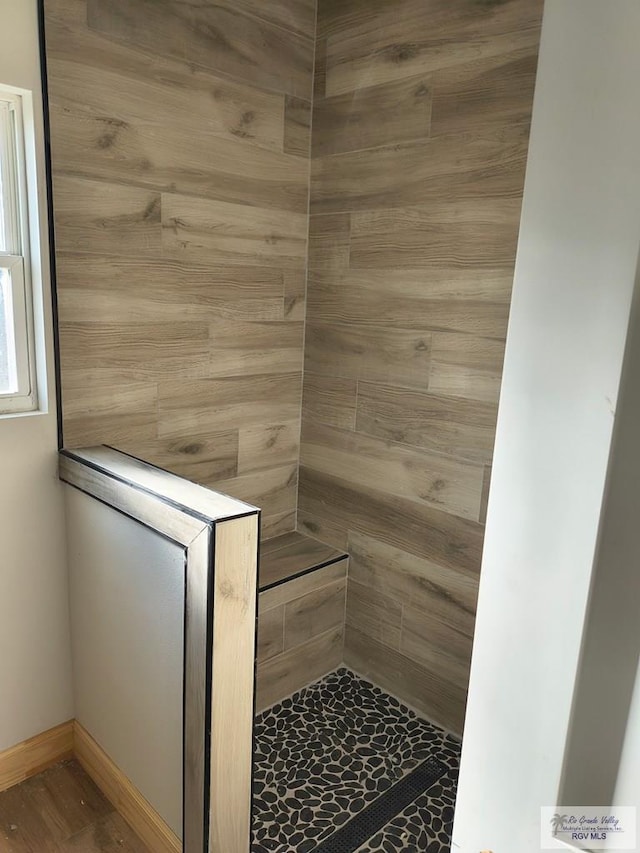 9728 Heights S Unit 9, Harlingen, TX 78552 - bathroom with tiled shower and a sauna / steam room