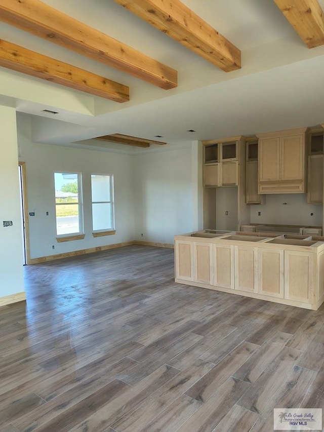 9728 Heights S Unit 9, Harlingen, TX 78552 - kitchen with beam ceiling, wood finished floors, and open floor plan