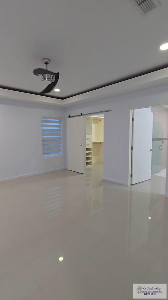 spare room with light tile patterned floors, baseboards, recessed lighting, and visible vents