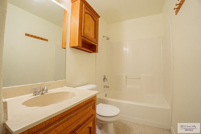 bathroom with vanity, shower / bathing tub combination, and toilet