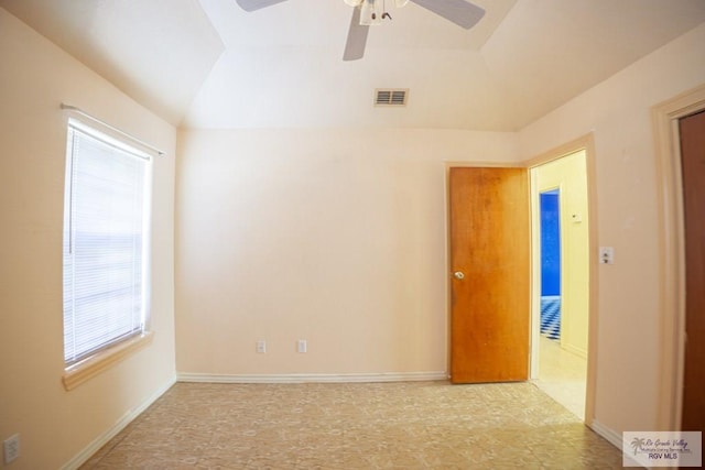 unfurnished room with visible vents, ceiling fan, baseboards, and lofted ceiling