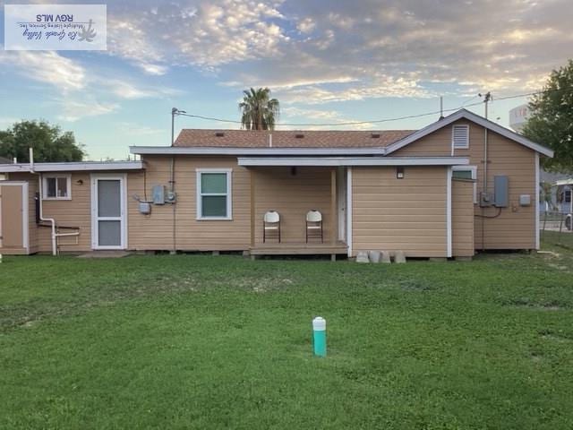 2009 Van Buren St, Brownsville, TX 78526 - back of property featuring a lawn