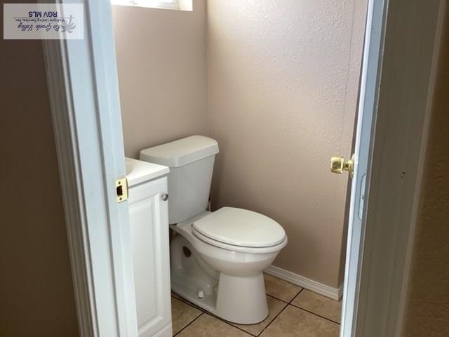 2009 Van Buren St, Brownsville, TX 78526 - half bathroom featuring tile patterned floors and vanity