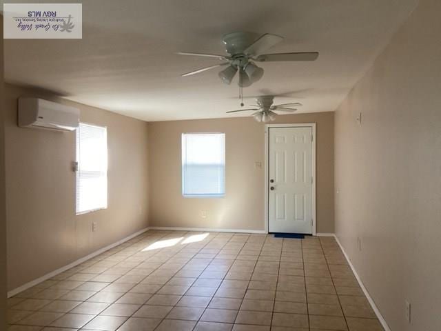 2009 Van Buren St, Brownsville, TX 78526 - tiled entrance foyer featuring an AC wall unit and a ceiling fan
