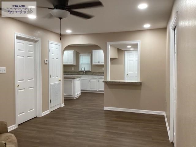 2009 Van Buren St, Brownsville, TX 78526 - kitchen featuring a ceiling fan, white cabinets, dark wood-type flooring, and recessed lighting
