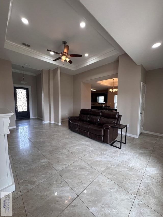 4805 N Westgate Cir, Harlingen, TX 78552 - living area featuring a tray ceiling, crown molding, baseboards, recessed lighting, and ceiling fan