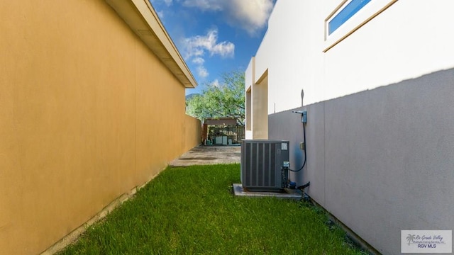 view of yard with central air condition unit