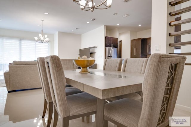 dining space featuring a chandelier