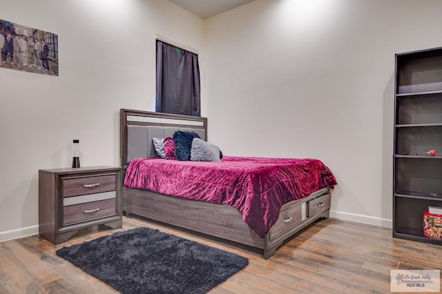 bedroom with wood-type flooring