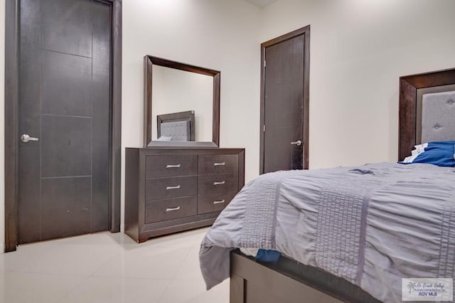 bedroom featuring light tile patterned floors