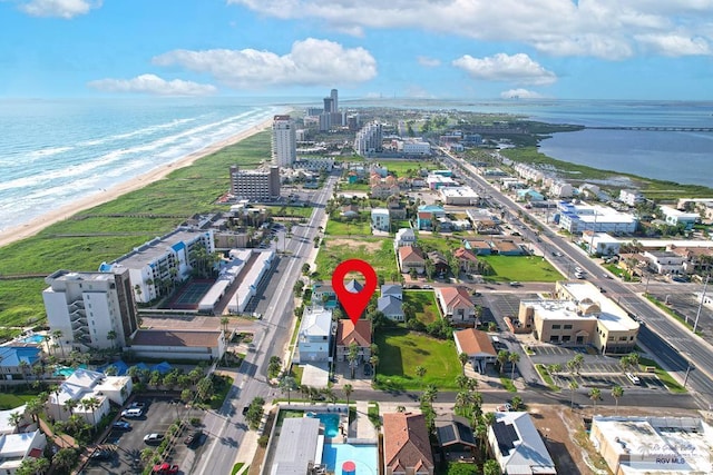 bird's eye view featuring a water view and a view of the beach