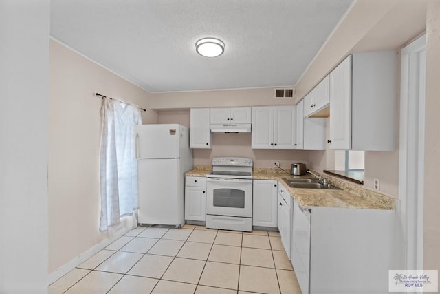 kitchen featuring a textured ceiling, white appliances, sink, white cabinets, and light tile patterned flooring