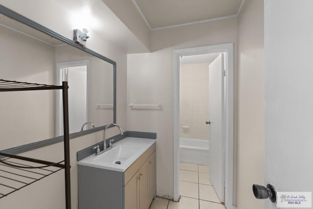 bathroom with tile patterned flooring and vanity