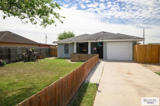 single story home featuring a garage and a front lawn