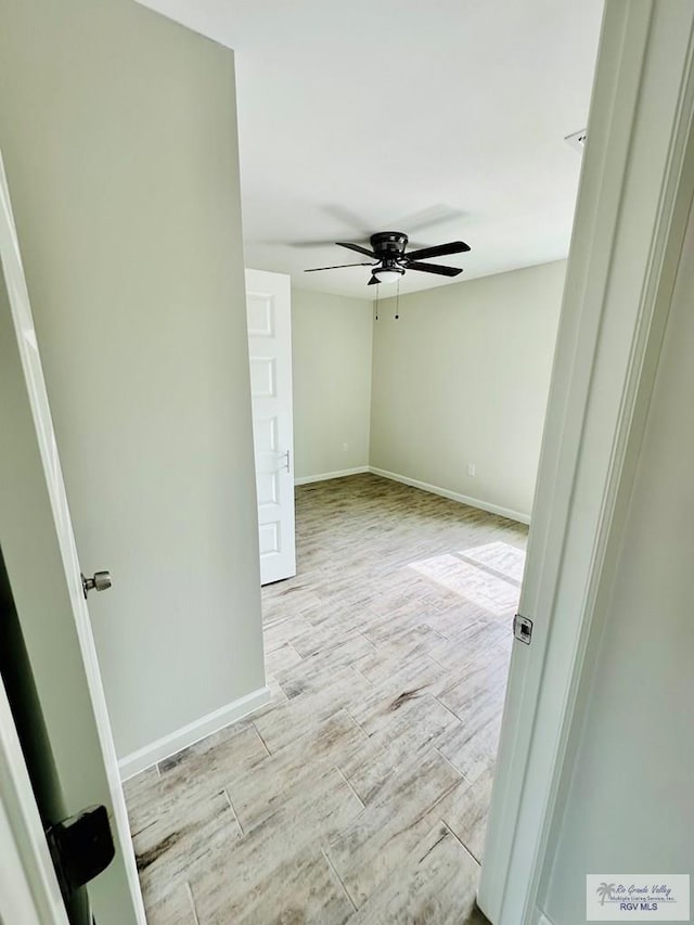 unfurnished room with ceiling fan and light hardwood / wood-style floors