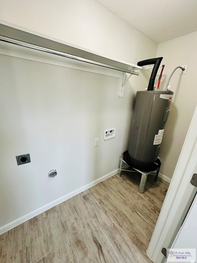 laundry room featuring hookup for a washing machine, electric water heater, hardwood / wood-style flooring, and electric dryer hookup