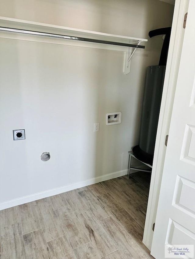 clothes washing area featuring hookup for an electric dryer, washer hookup, and light hardwood / wood-style floors