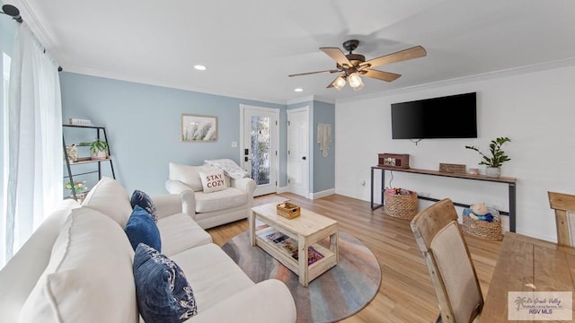 living room featuring recessed lighting, crown molding, a ceiling fan, and wood finished floors