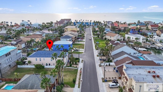 bird's eye view featuring a residential view and a water view