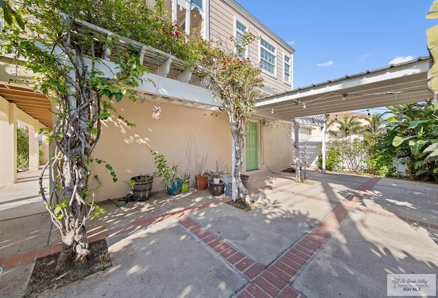 view of patio / terrace featuring fence