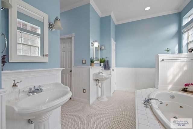 full bathroom with crown molding, tile patterned floors, a whirlpool tub, and wainscoting