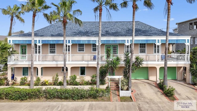 view of property featuring an attached garage and driveway