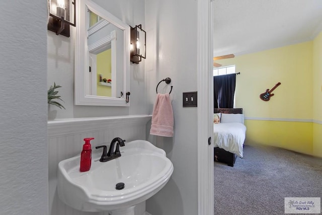 ensuite bathroom featuring a sink and ensuite bathroom