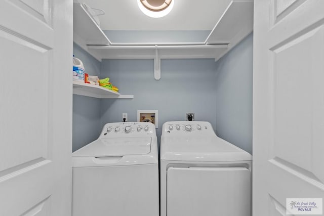 washroom featuring laundry area and washer and dryer