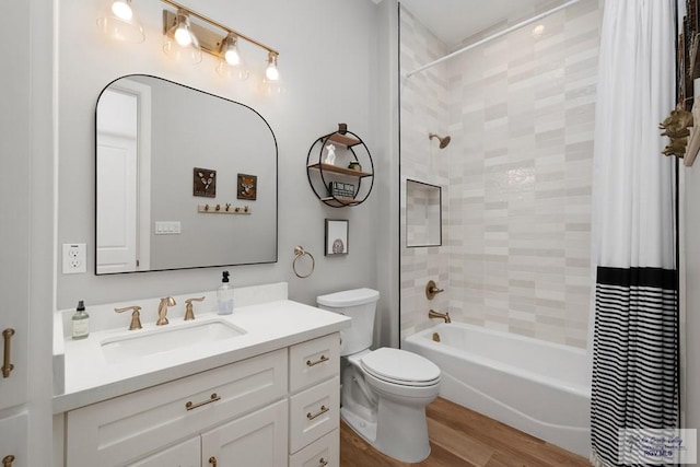 1709 Thacker Ln, Harlingen, TX 78552 - full bath featuring wood finished floors, shower / tub combo, toilet, and vanity