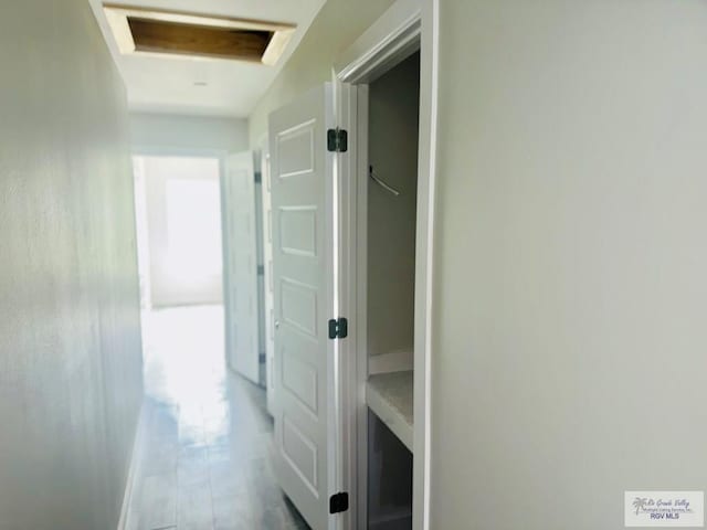 hall with wood finished floors