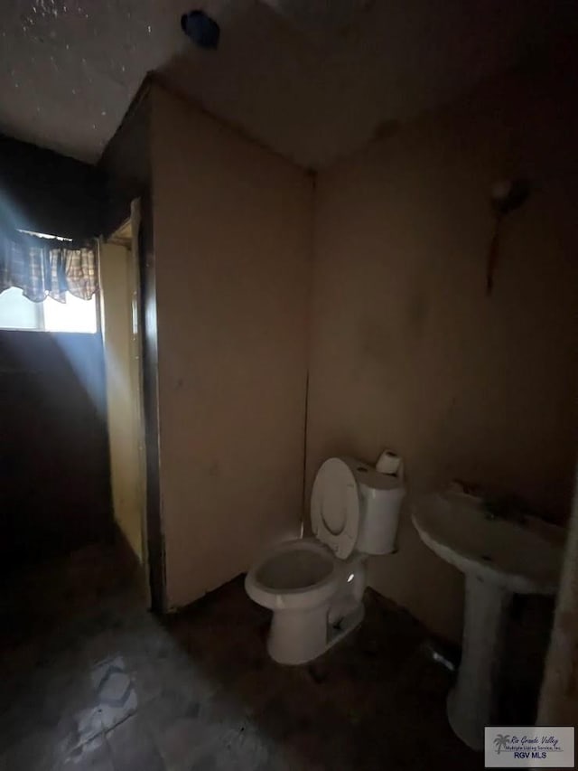 bathroom featuring toilet