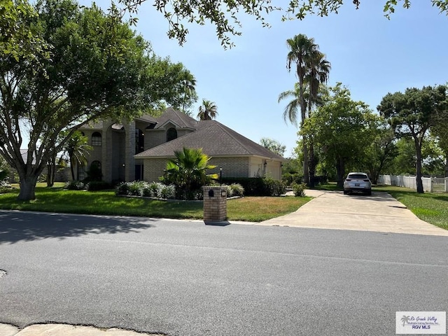 view of property exterior featuring a lawn