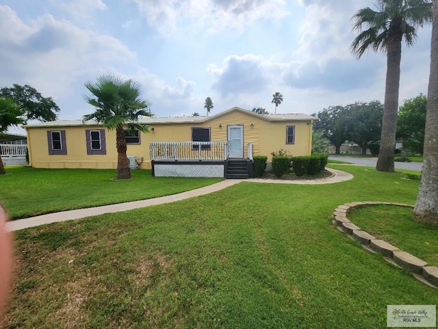 view of front of house with a wooden deck, central AC unit, and a front yard