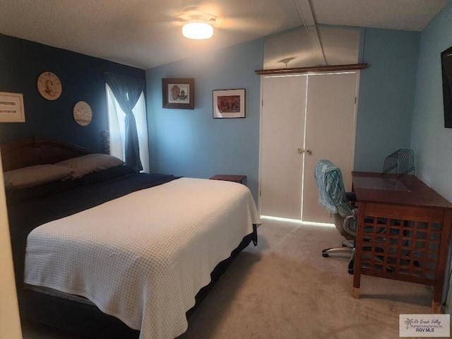 bedroom with carpet flooring, ceiling fan, and lofted ceiling