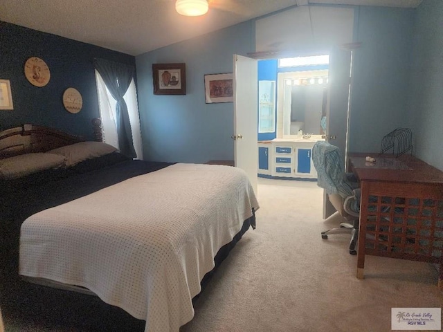 bedroom with light carpet and lofted ceiling