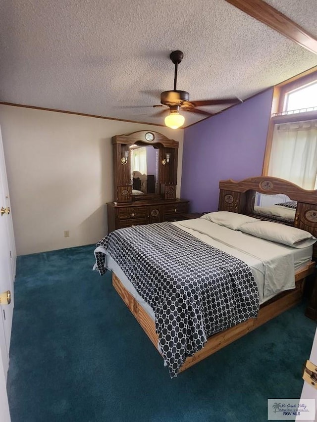 bedroom featuring carpet, a textured ceiling, and ceiling fan