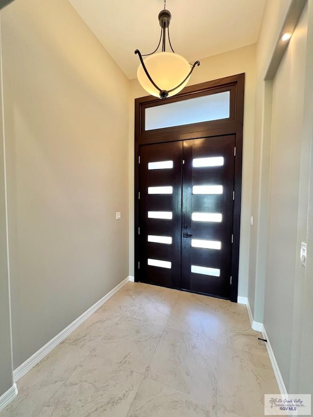 814 Knotty Pine Ln, Harlingen, TX 78552 - entrance foyer featuring light marble finish floors and baseboards
