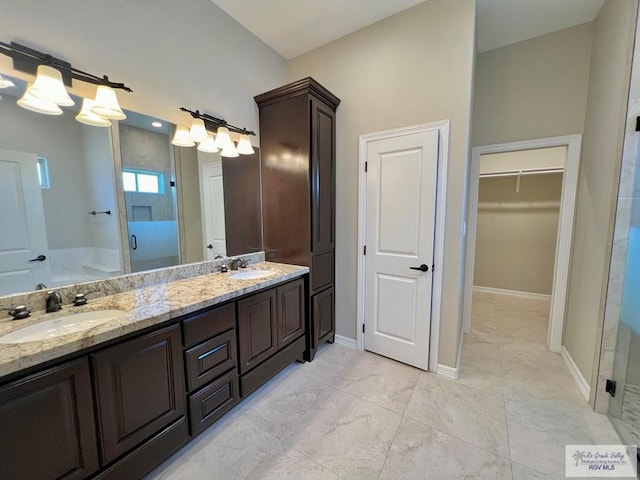 814 Knotty Pine Ln, Harlingen, TX 78552 - full bathroom featuring a stall shower, double vanity, marble look tile flooring, a bath, and a walk in closet