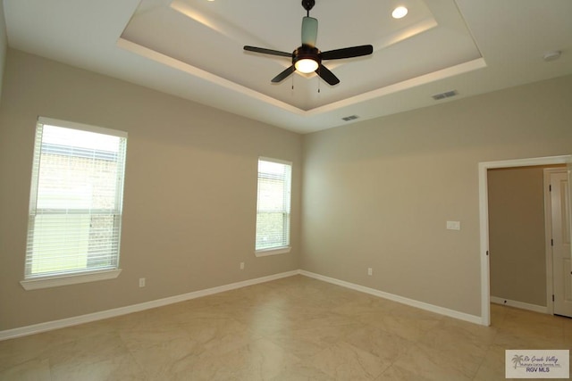 814 Knotty Pine Ln, Harlingen, TX 78552 - unfurnished room featuring a raised ceiling and ceiling fan
