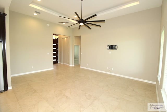 814 Knotty Pine Ln, Harlingen, TX 78552 - unfurnished room featuring recessed lighting, a ceiling fan, light marble finish floors, and a raised ceiling