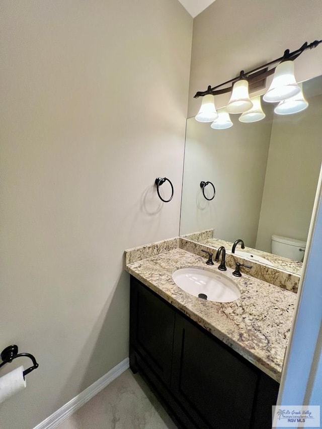 814 Knotty Pine Ln, Harlingen, TX 78552 - bathroom featuring vanity and baseboards