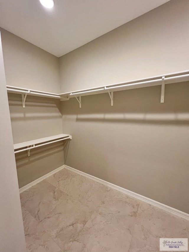 814 Knotty Pine Ln, Harlingen, TX 78552 - walk in closet with marble finish floors