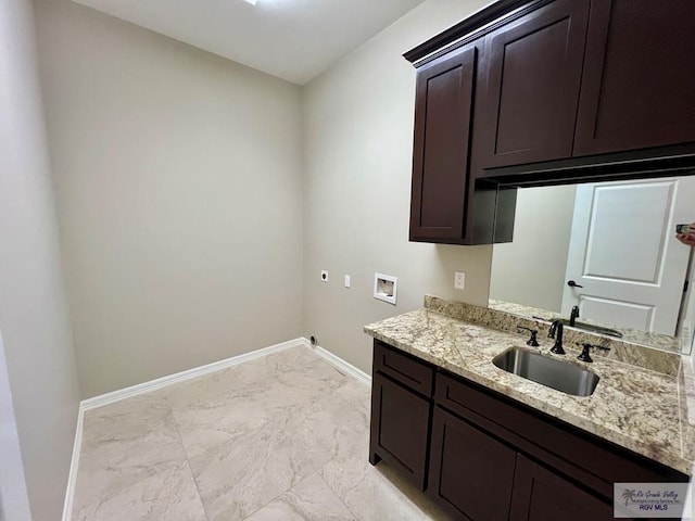 814 Knotty Pine Ln, Harlingen, TX 78552 - laundry room with electric dryer hookup, hookup for a washing machine, light marble finish floors, and cabinet space