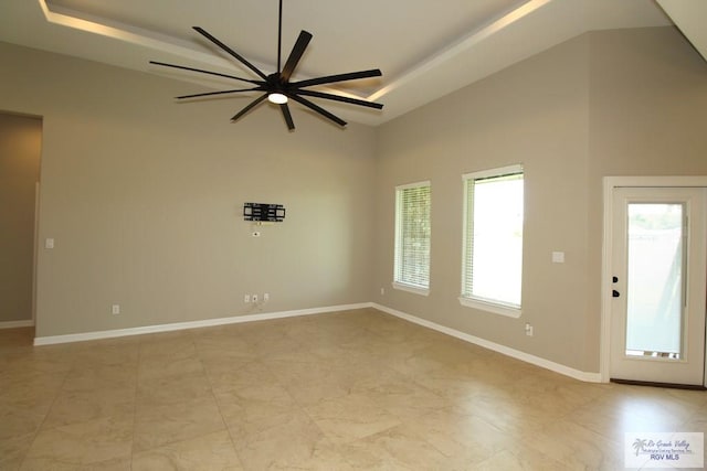814 Knotty Pine Ln, Harlingen, TX 78552 - unfurnished room featuring a ceiling fan, a high ceiling, and light tile patterned floors