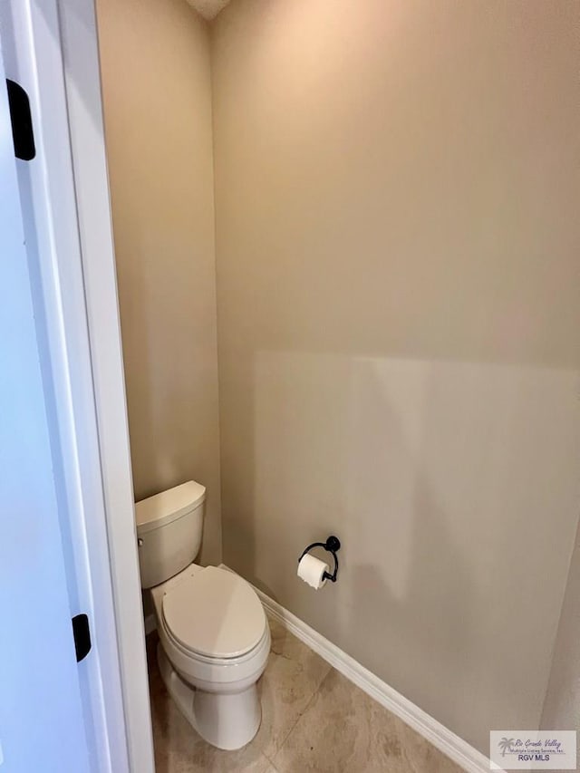 814 Knotty Pine Ln, Harlingen, TX 78552 - bathroom featuring toilet and tile patterned flooring