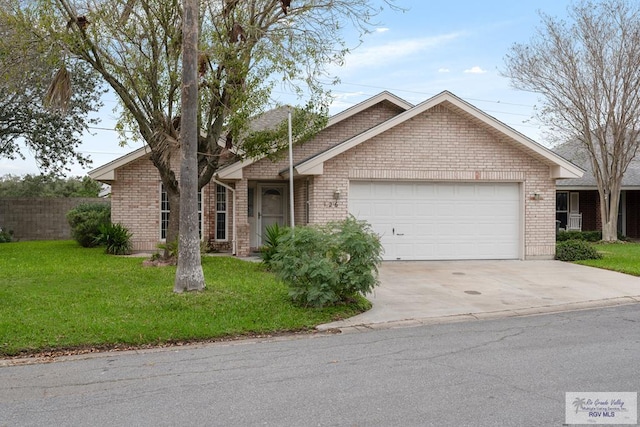 ranch-style house featuring a front yard and a garage