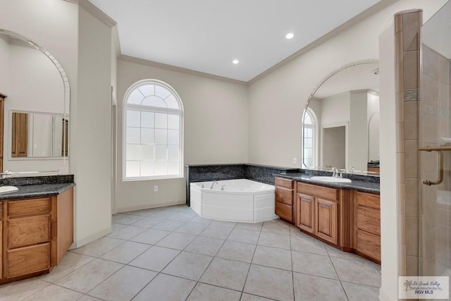 bathroom with a sink, two vanities, ornamental molding, and tile patterned flooring