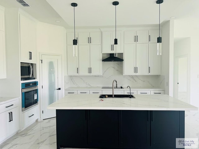 1321 White Oak Dr, Harlingen, TX 78522 - kitchen with stainless steel appliances, exhaust hood, a sink, white cabinetry, and light marble finish floors
